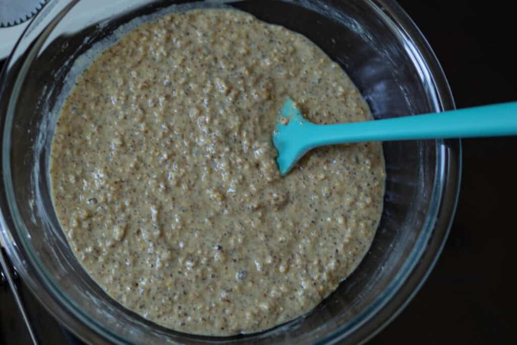 Lemon poppyseed muffin batter in large glass bowl.