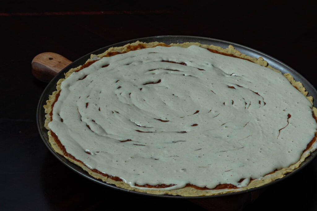 Large pizza with liquid mozzarella, uncooked.
