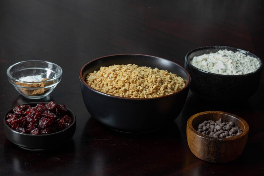 Muffin ingredients - craisins, spices, TVP, chocolate chips, flour.
