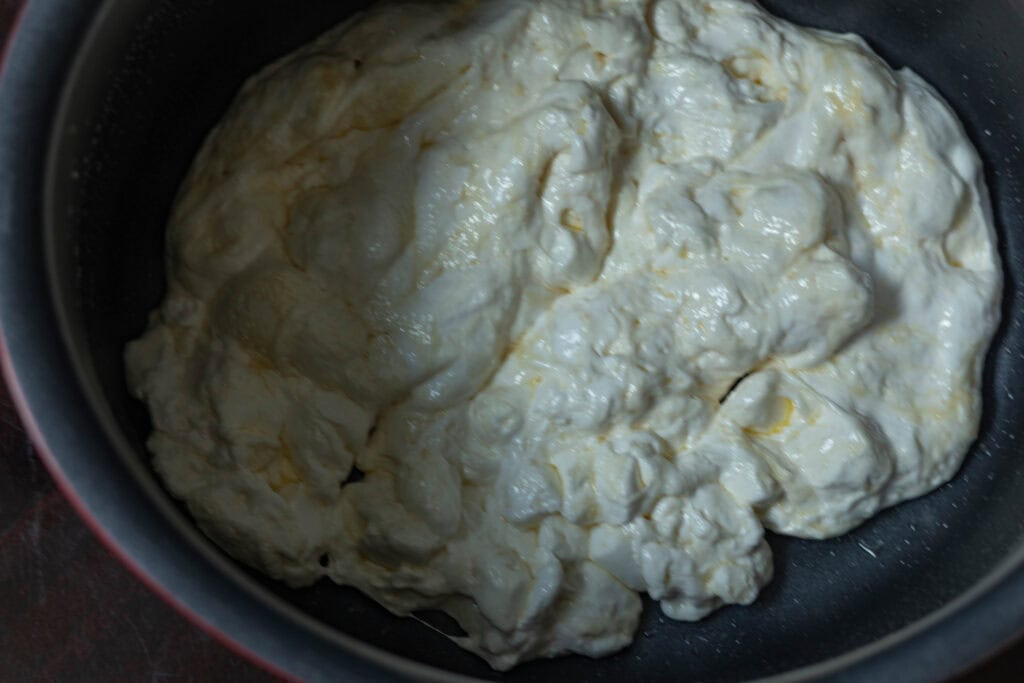 Large pot with marshmallow goo after they have been heated and combined.