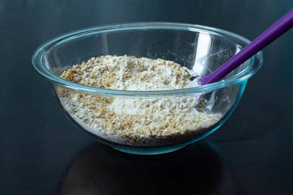 Dry ingredients mixed together in a glass bowl.