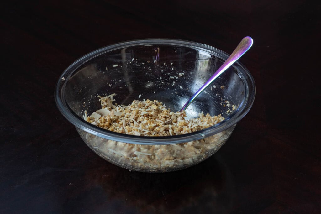 Medium glass bowl with the stuffing mixture.