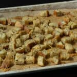 High protein croutons on a parchment paper lined baking sheet.