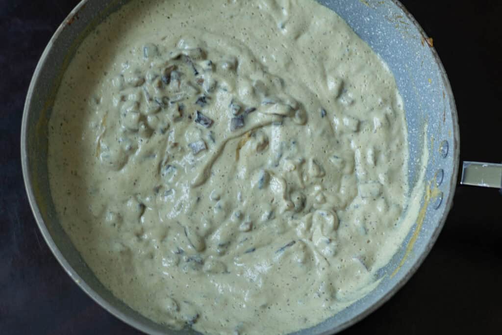 Condensed mushroom soup in a pan.