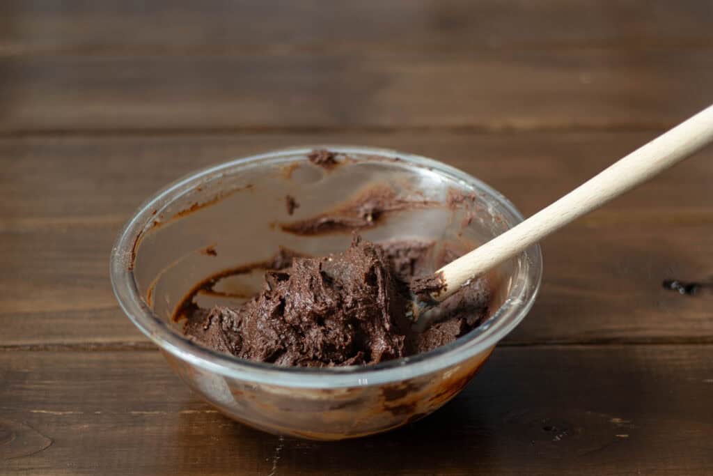 Protein brownie batter in a glass bowl.