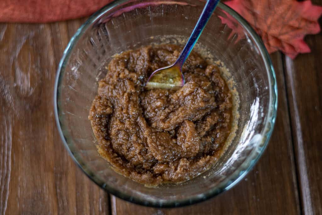 Pumpkin apple muffin brown sugar topping mixed in a small glass bowl.