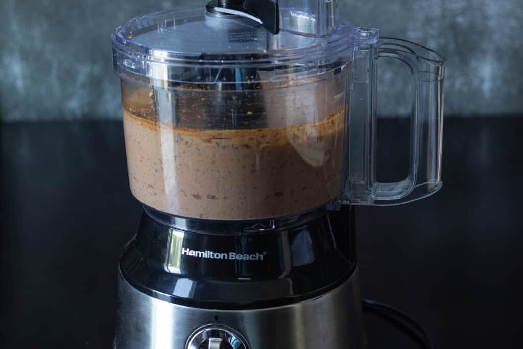 Black bean, tofu, and seasonings blended up in a food processor.