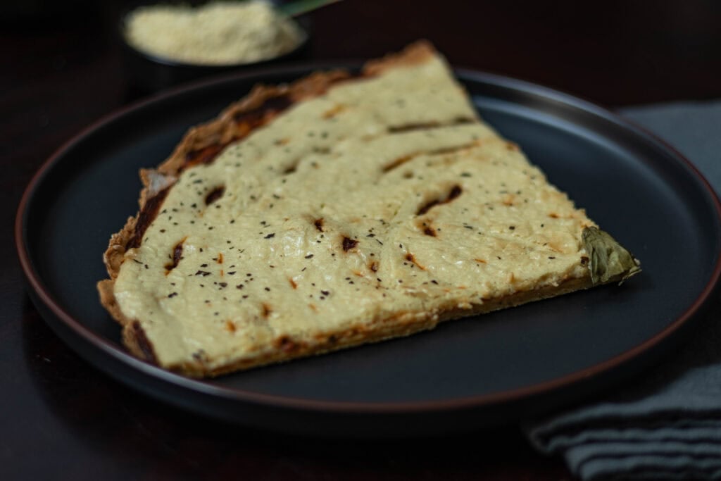 Slice of pizza with liquid mozzarella.