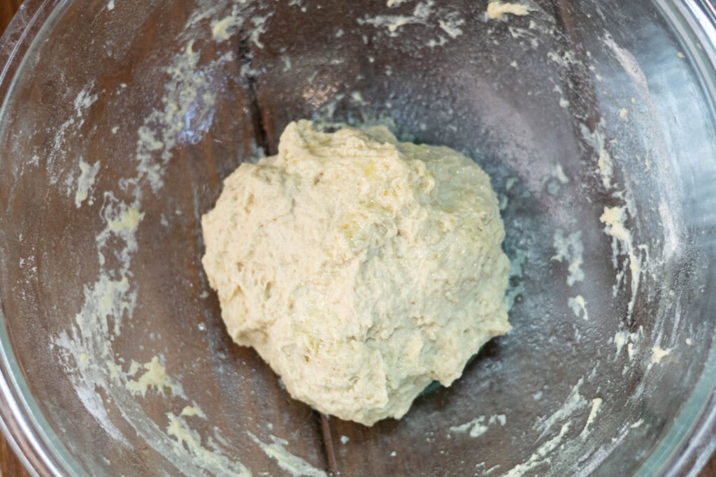 Pretzel bite dough in a large glass bowl.