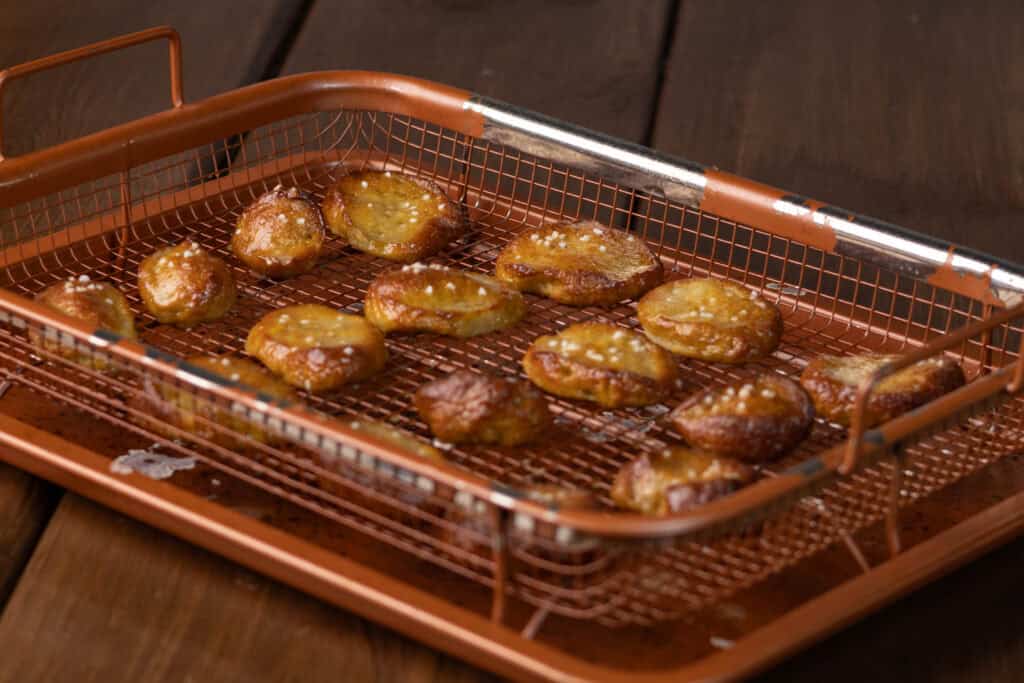 Pretzel bites on a copper crisping tray.