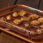 Pretzel bites on a copper crisping tray.