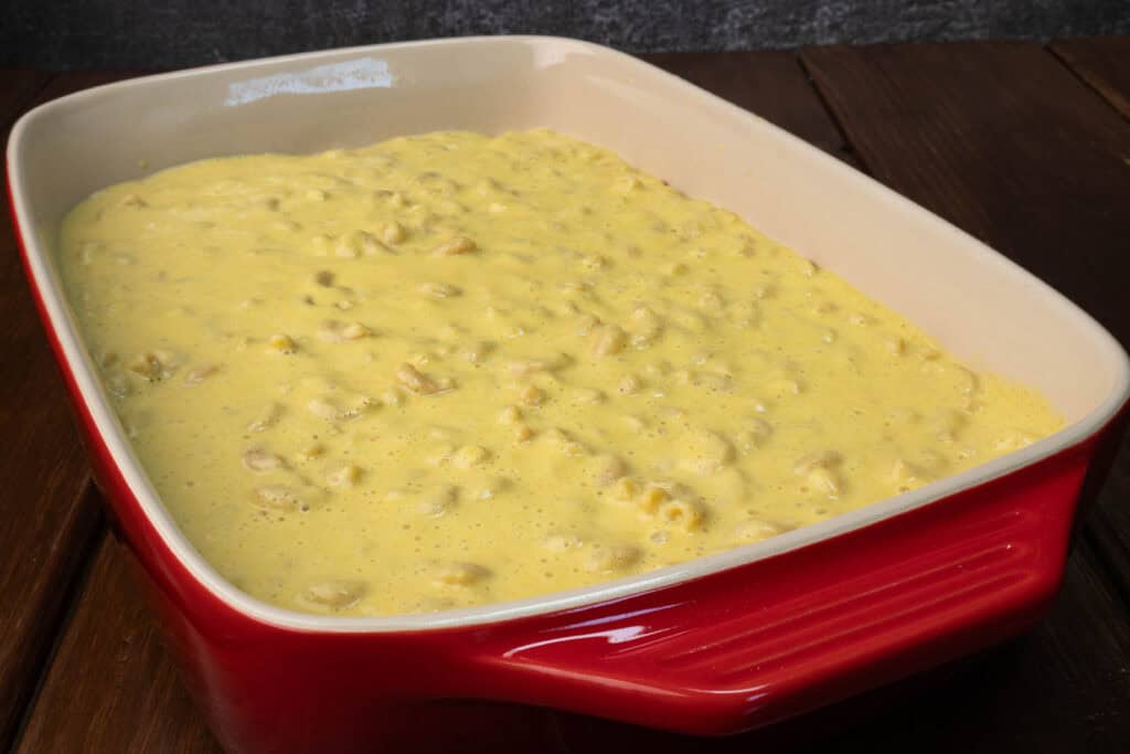 Casserole dish with unbaked butternut squash mac and cheese.