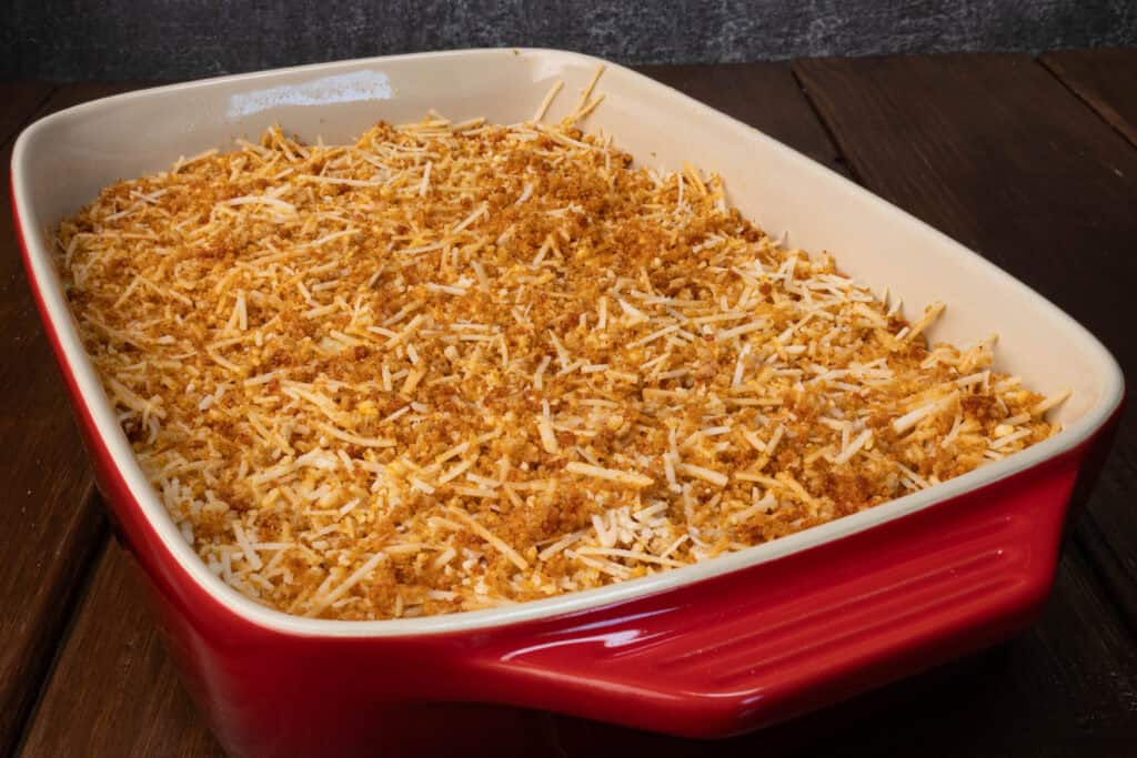 Unbaked butternut squash mac and cheese with breadcrumbs.