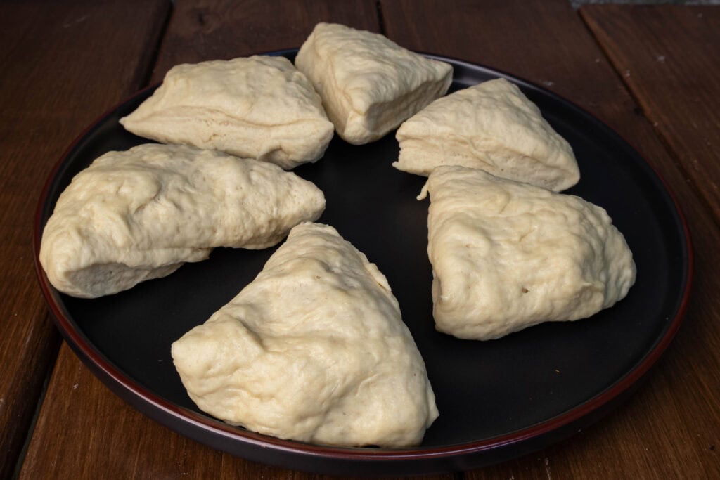 Bagel dough cut into 6 pieces.