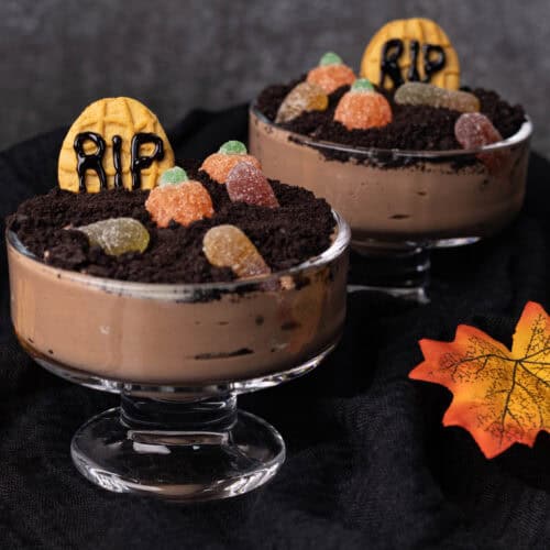 Dirt Pudding in little pudding glasses on a Fall decorated table.