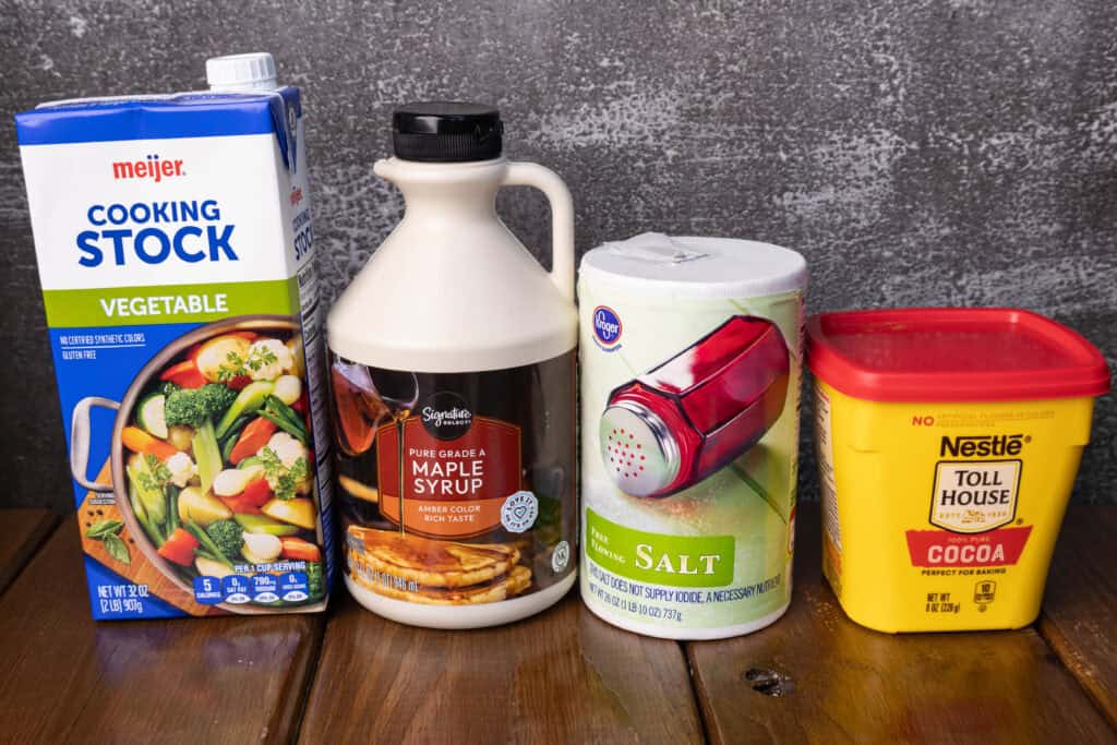 Ingredients for chili - vegetable broth, maple syrup, salt and cocoa powder.
