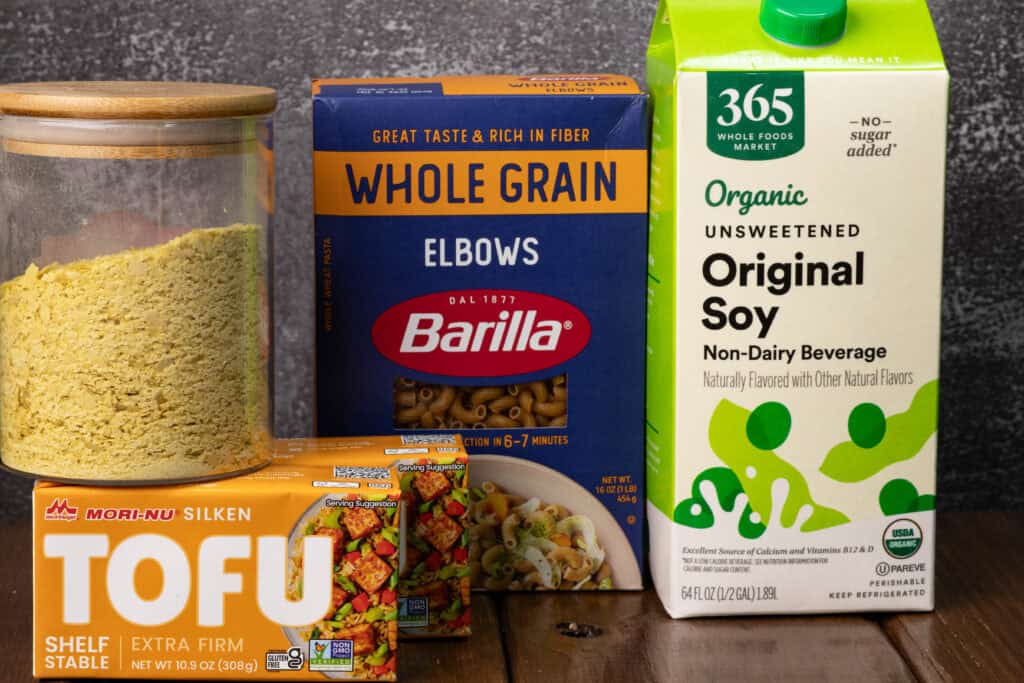 Nutritional yeast, silken tofu, elbow pasta and soy milk.