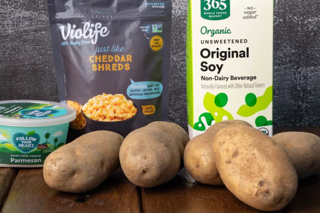 Vegan parmesan, vegan cheddar, potatoes and soy milk.