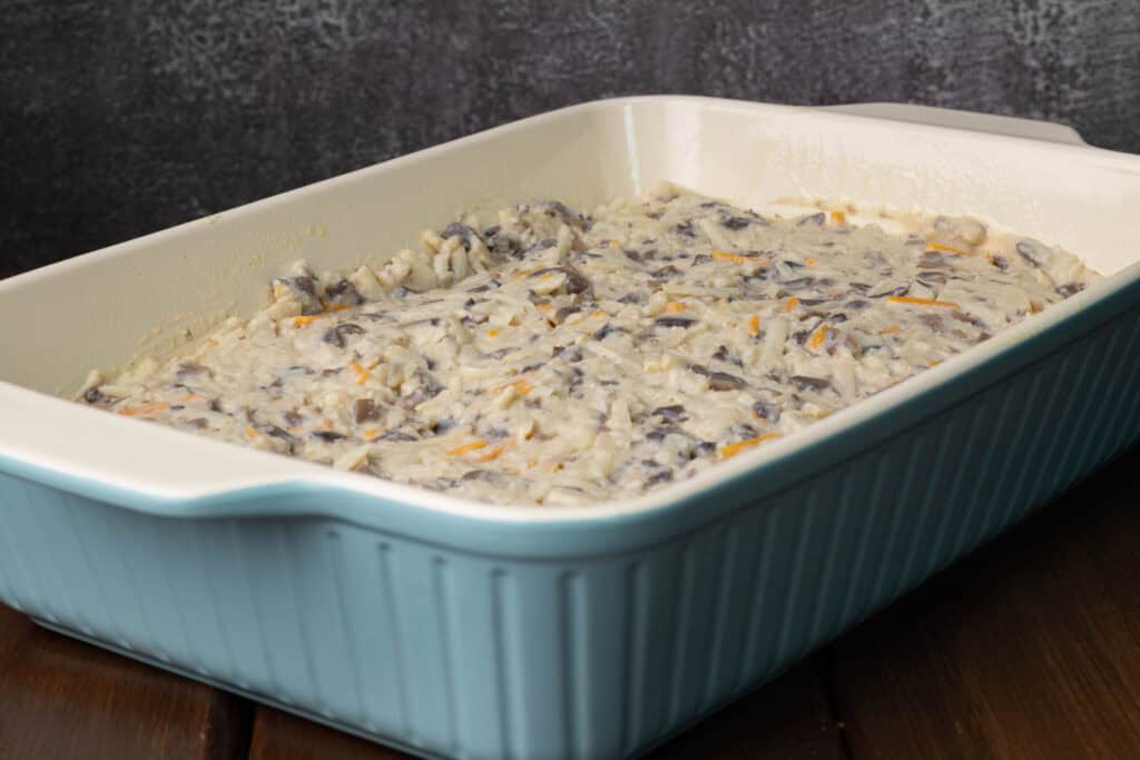 Hashbrown casserole in a large blue casserole dish.