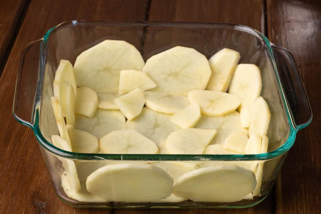 Potato crust in a baking dish.