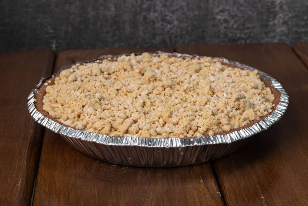 Pudding pie with a peanut butter crumble on top.