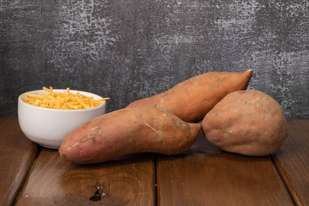Shredded vegan cheese and sweet potatoes.