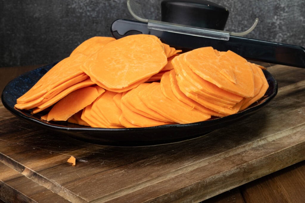 Thinly sliced sweet potatoes and a mandolin.