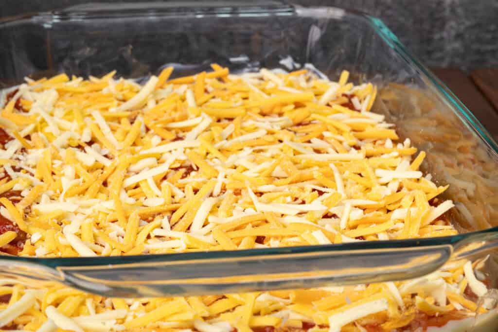 Shredded cheese layer of the taco dip.