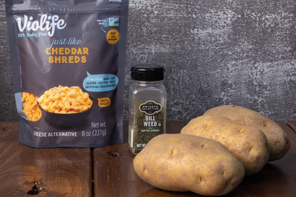 Vegan shredded cheese, dried dill, and potatoes.