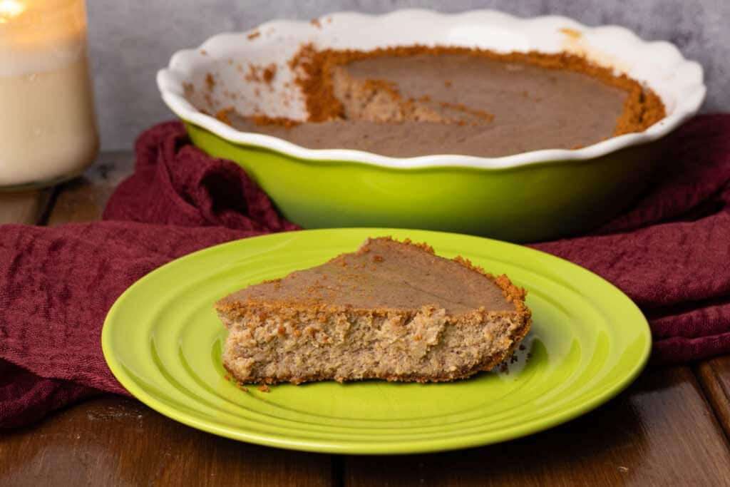 Biscoff cheesecake on a pretty green plate.