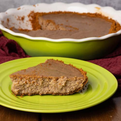 Biscoff cheesecake on a pretty green plate.