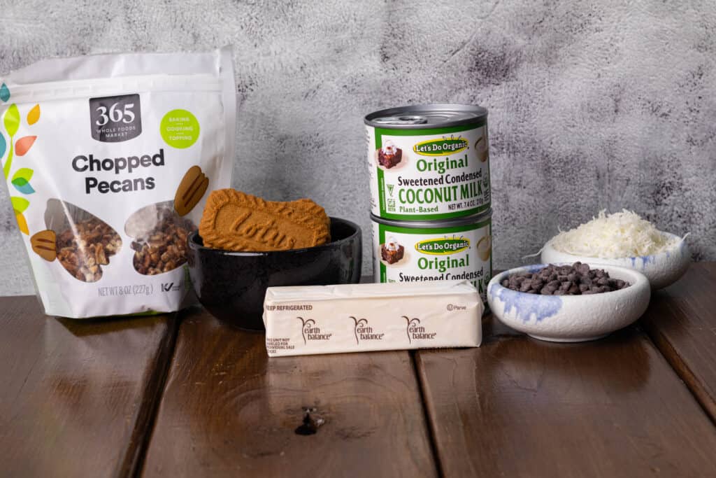 Chopped pecans, Biscoff cookies, vegan butter, sweetened condensed coconut milk, chocolate chips and sweetened coconut.