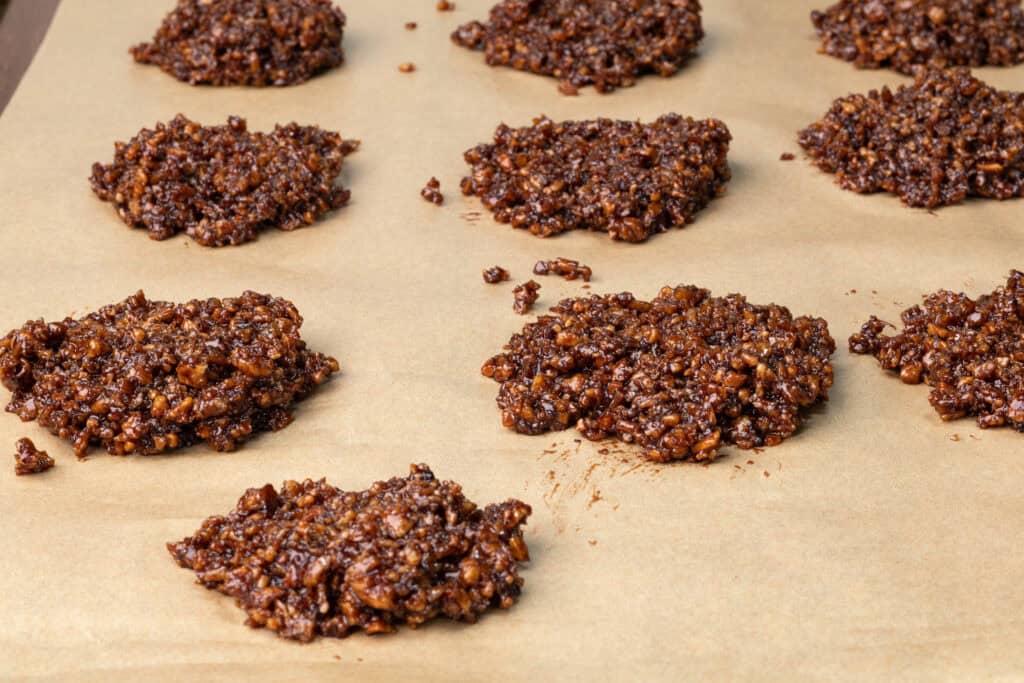 High protein vegan no-bake cookies on parchment paper.