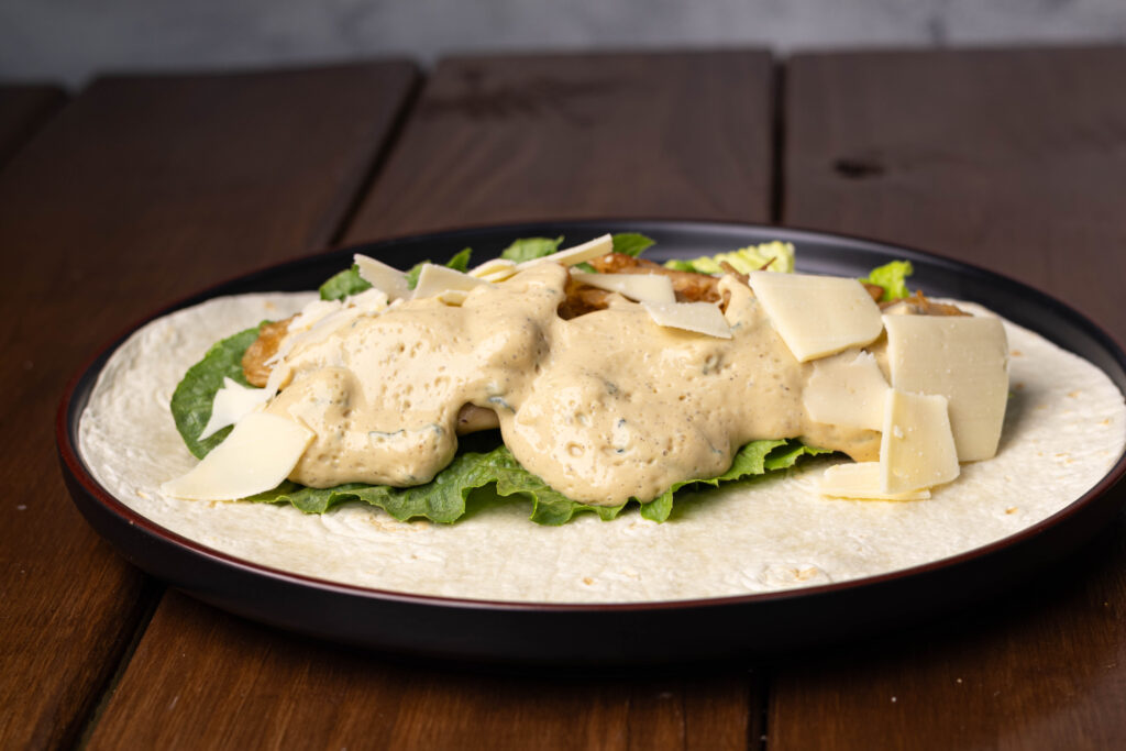 Opened vegan caesar chicken wrap.