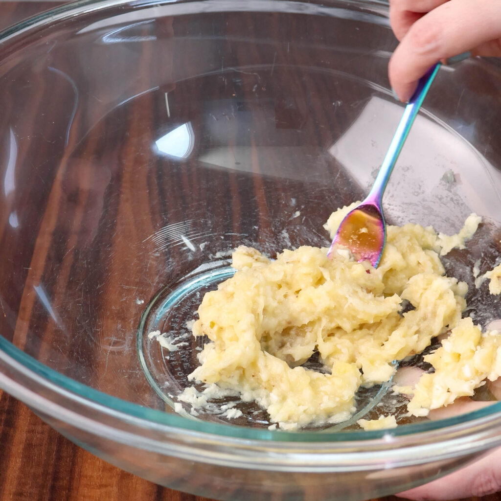 Mashed bananas in a bowl.