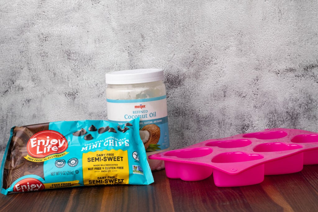 Mini vegan chocolate chips, coconut oil, and heart shaped molds.