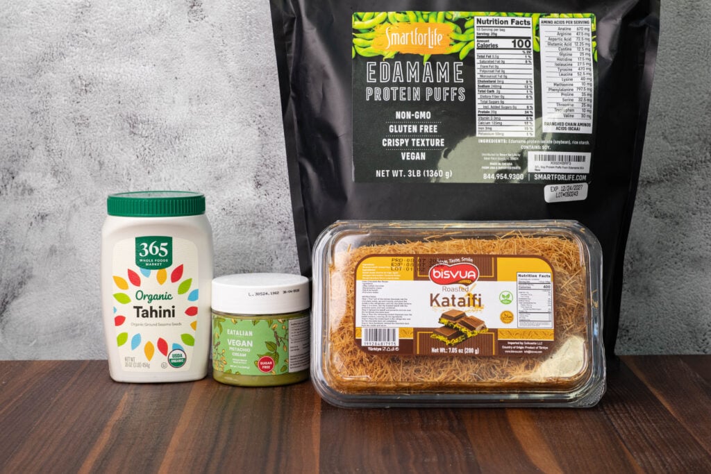 Tahini, vegan pistachio cream, roasted kataifi, and edamame puffs.