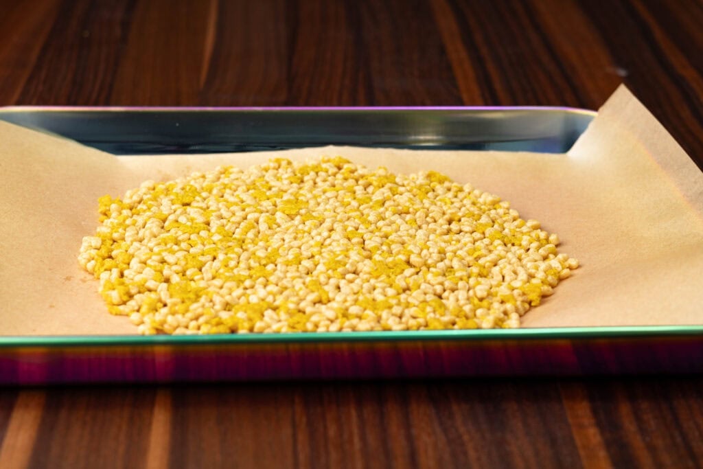 Vegan Cheesy Protein Edamame Puffs on a cookie sheet.
