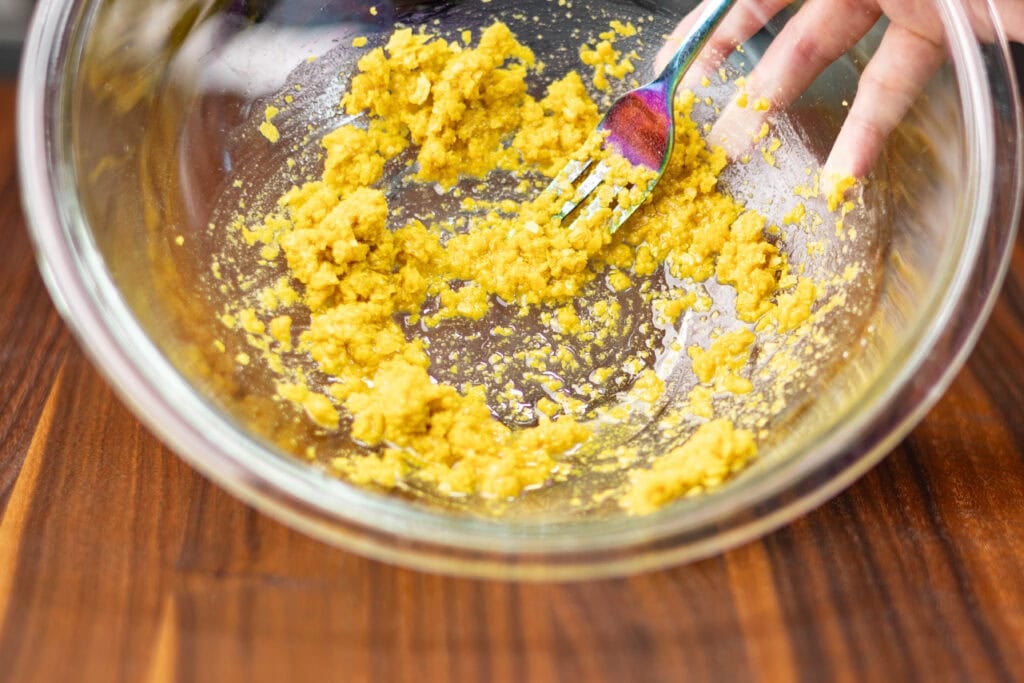 Mixture of melted coconut oil and seasoning in a bowl.