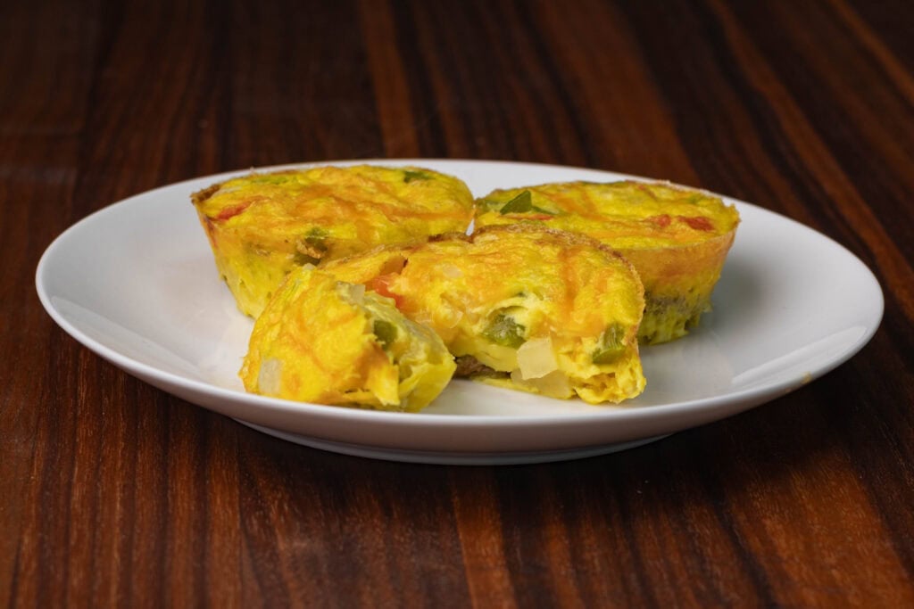 Vegan eggbites on a white plate.
