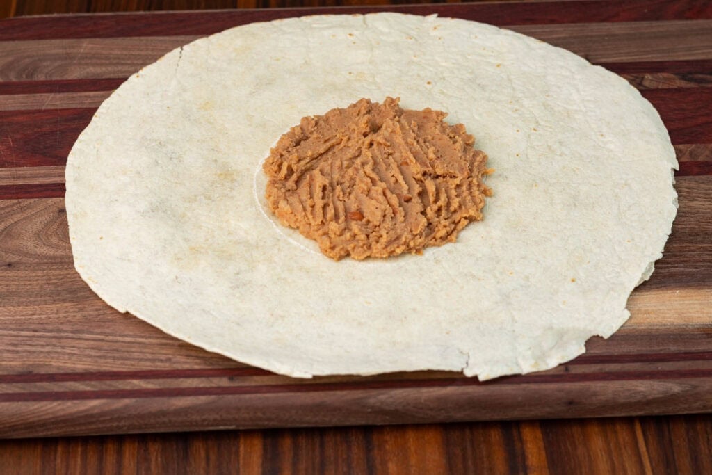 TVP crunchwrap - the refried bean layer.
