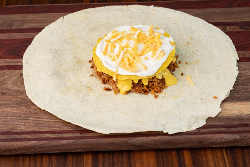TVP crunchwrap - the vegan shredded cheese layer.