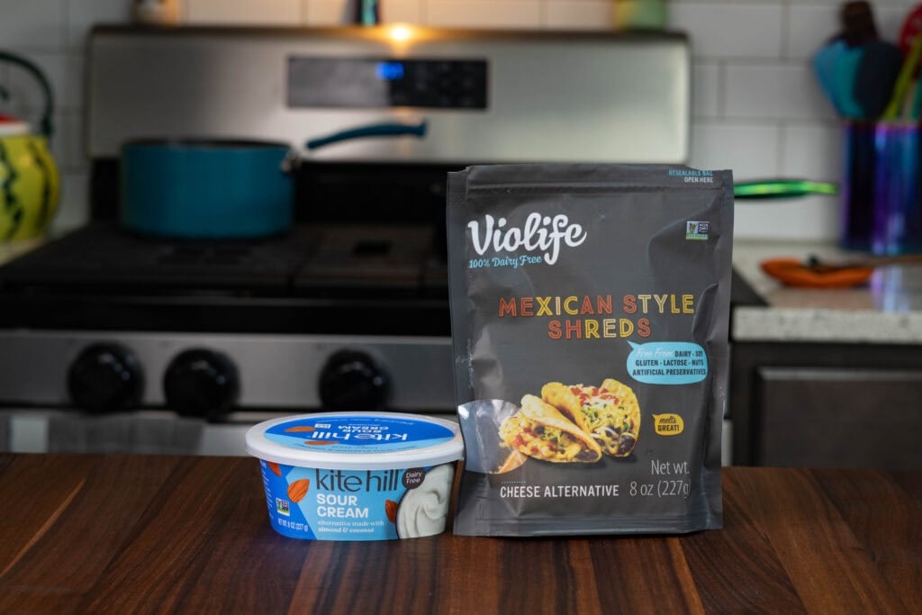 Vegan sour cream and vegan shredded cheese.
