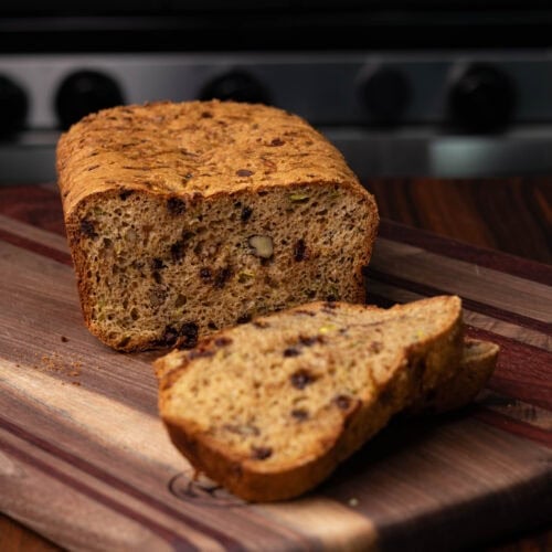High Protein vegan zucchini bread on a wooden cutting board.